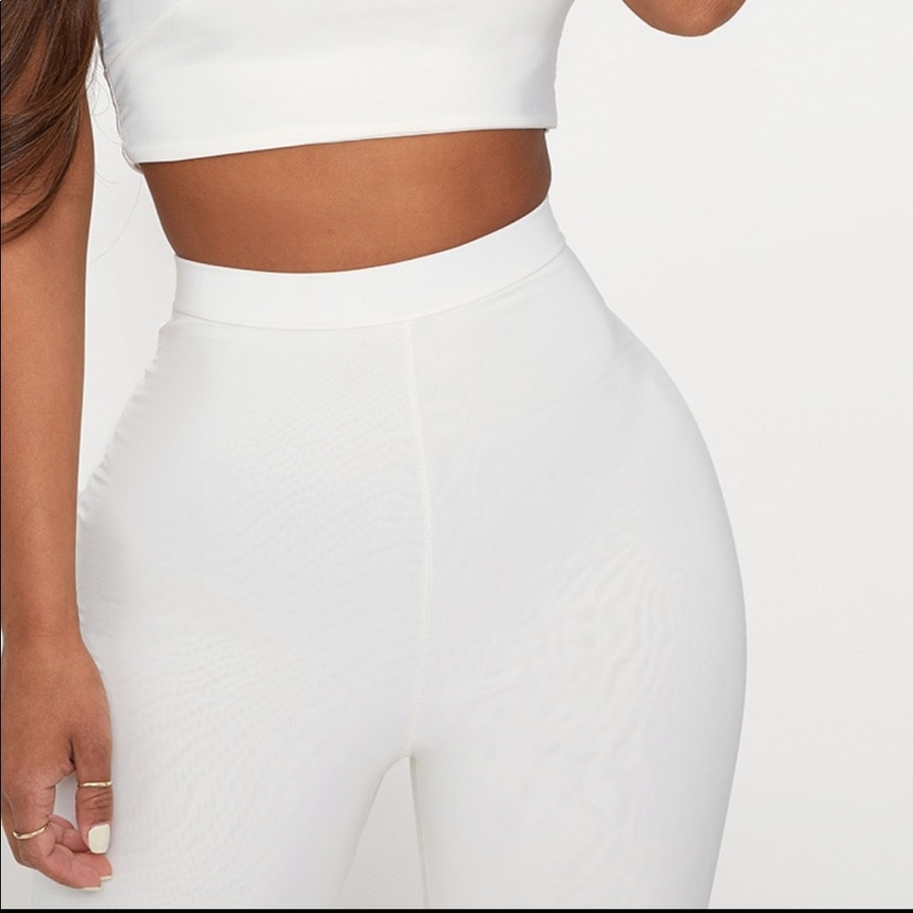 All white slinky flared pants
